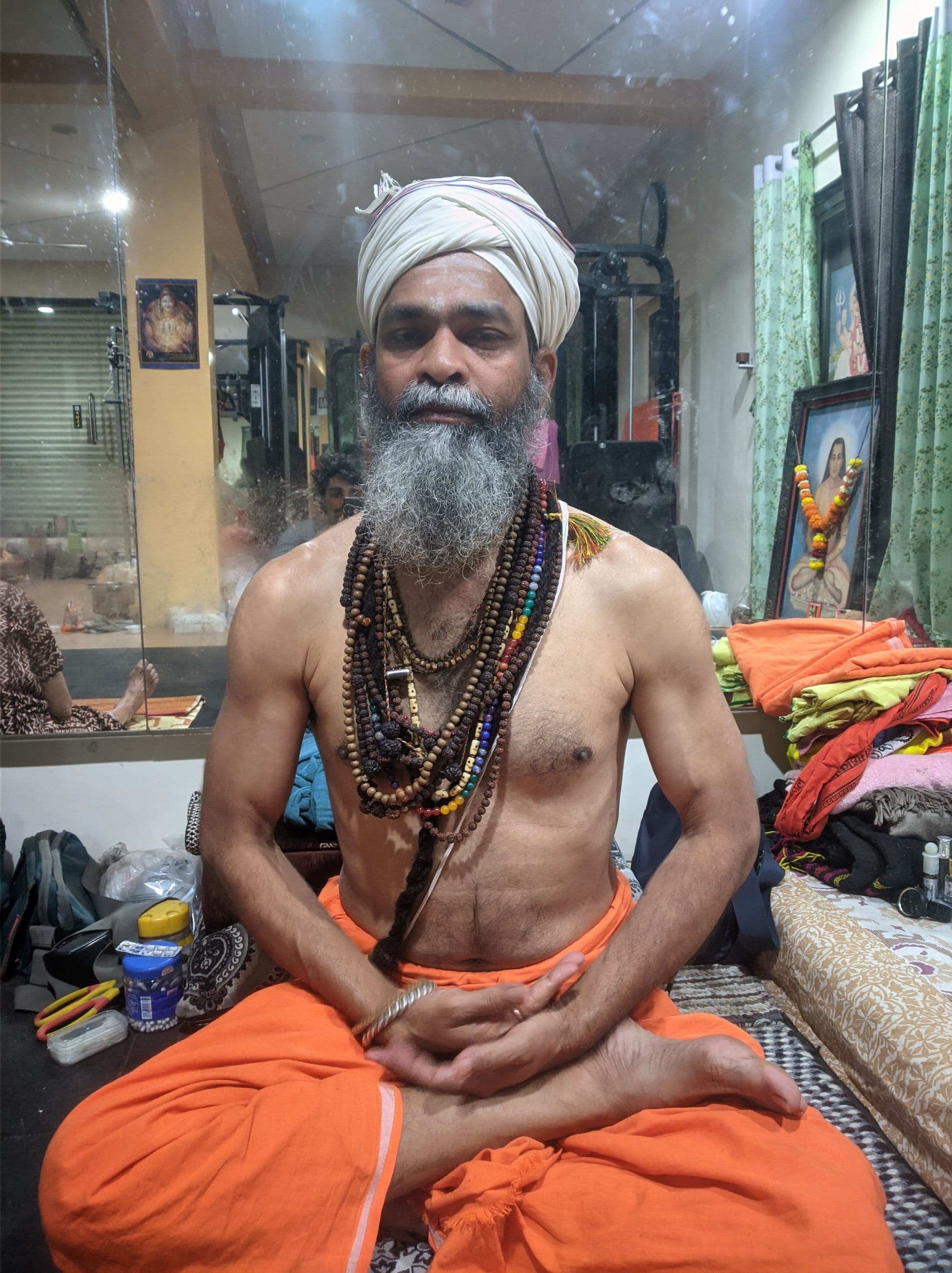 Guru Sanjay Nath seated in meditation, hands open in his lap